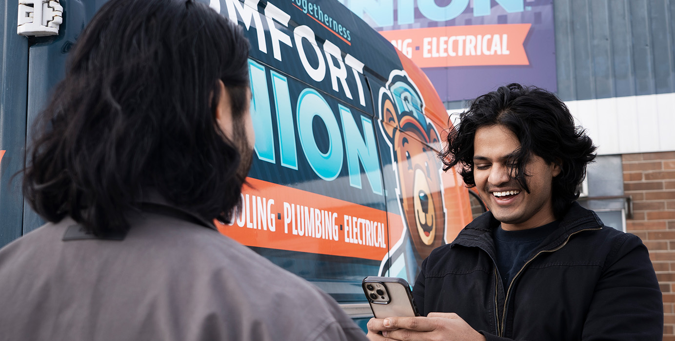 A picture of a merchant using the Helcim App