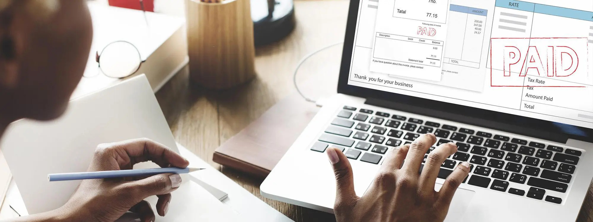 woman paying an invoice by credit card online